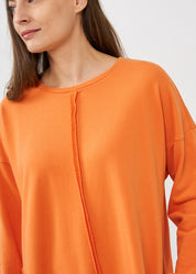 Long sleeve dress with external seams, orange