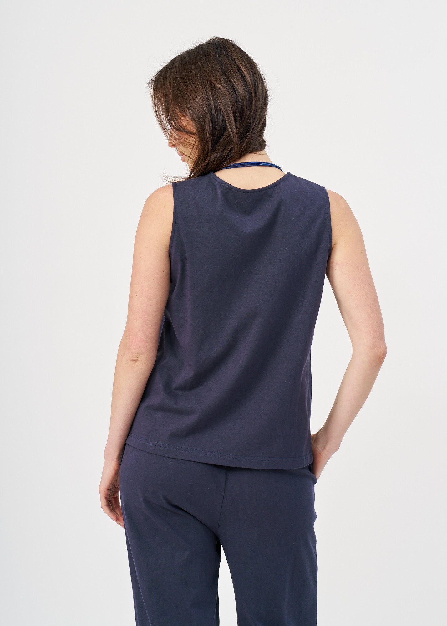 Blue jersey tank top with slit in the hem