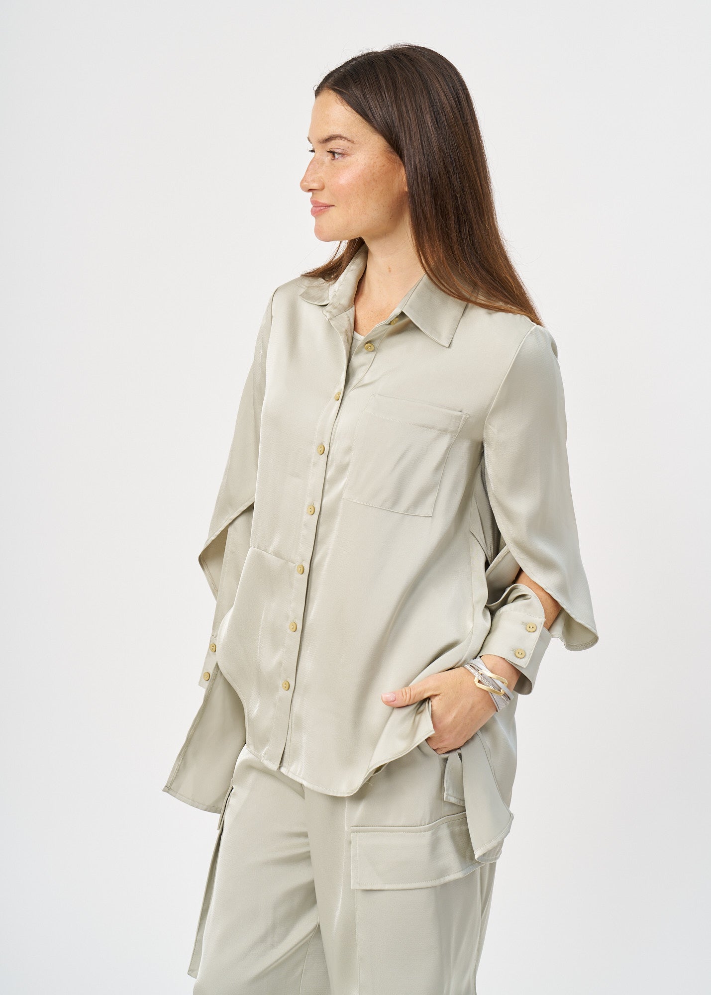Green satin button-down shirt with open sleeves