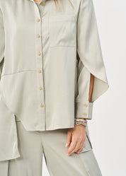 Green satin button-down shirt with open sleeves