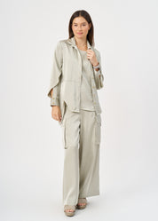 Green satin button-down shirt with open sleeves