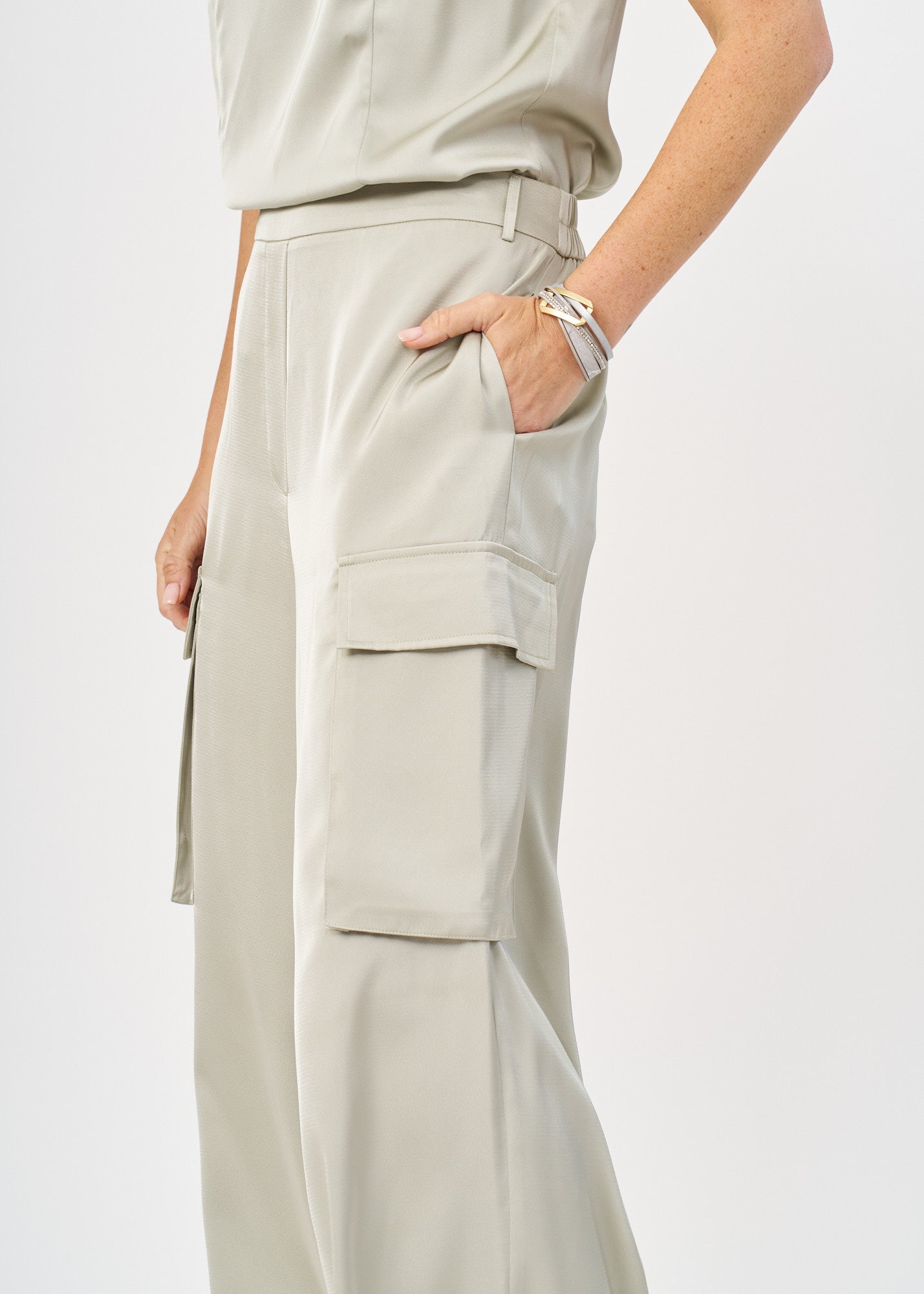 Green satin pants with pockets