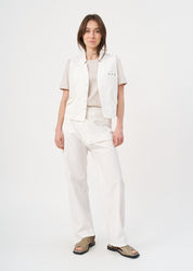 Folded pocket vest with white button