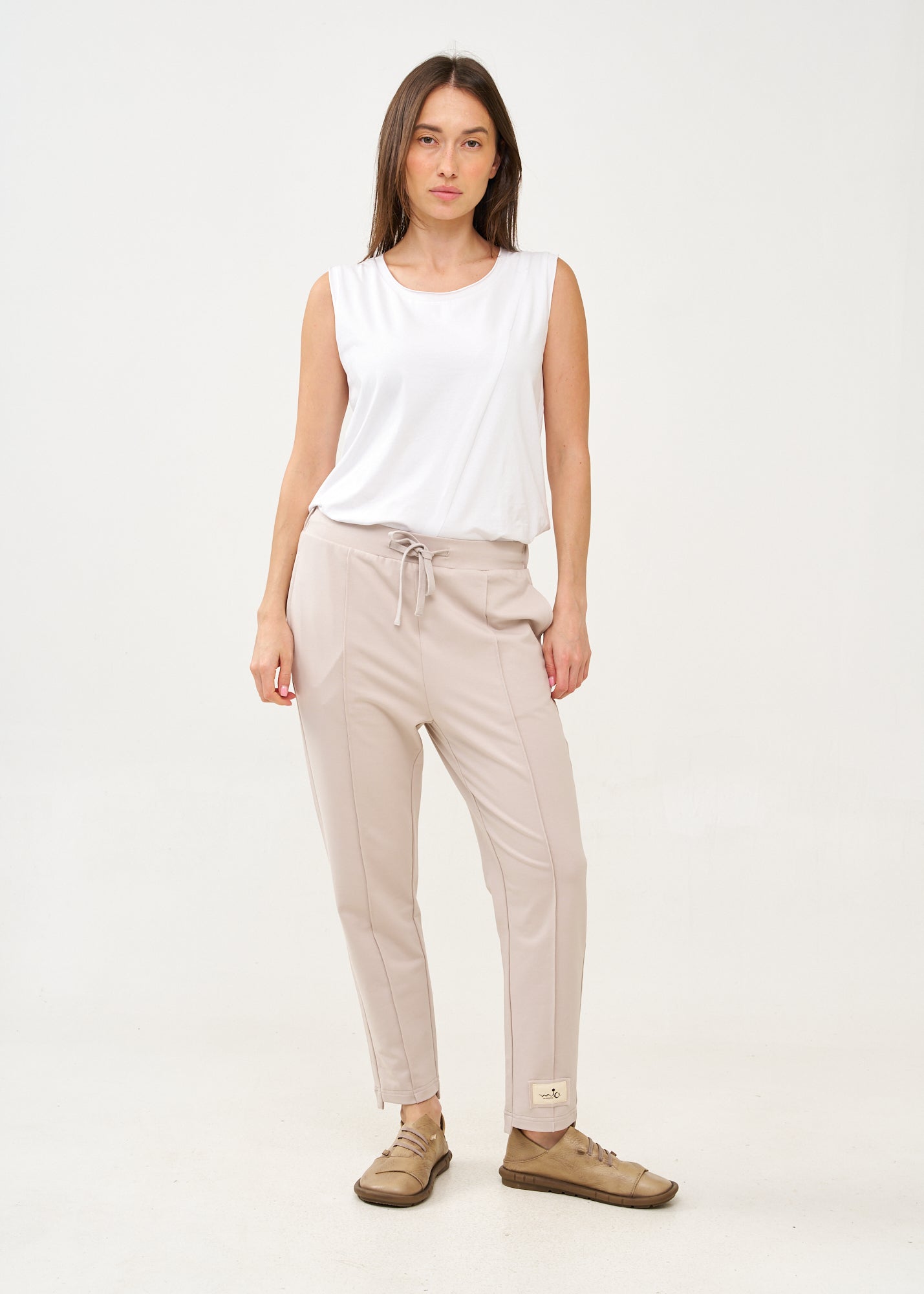 Pants with a seam in the middle and a stone patch