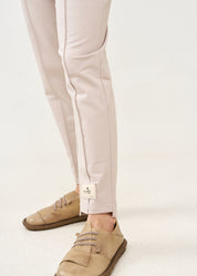 Pants with a seam in the middle and a stone patch