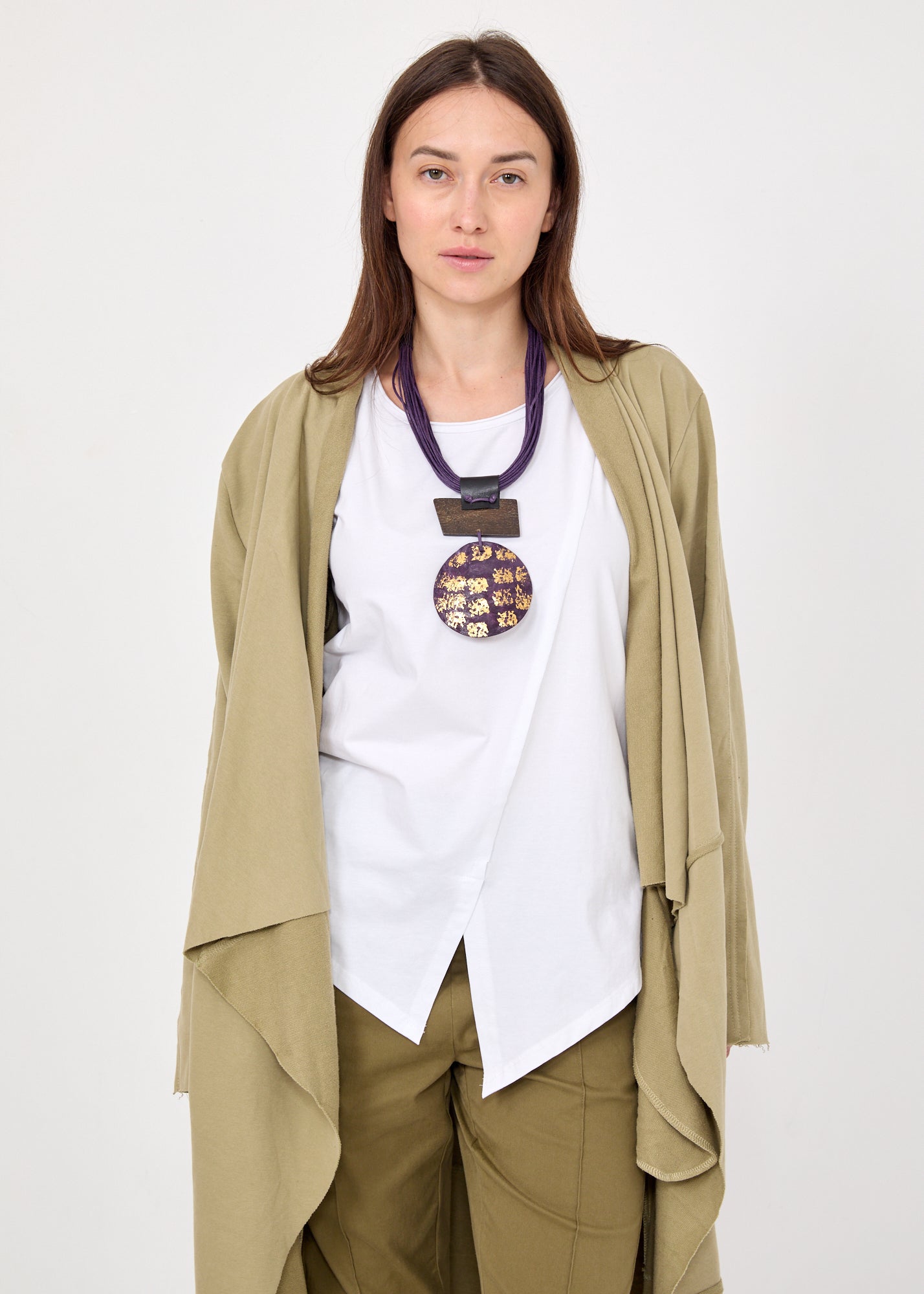 Belted top tied with a green waist