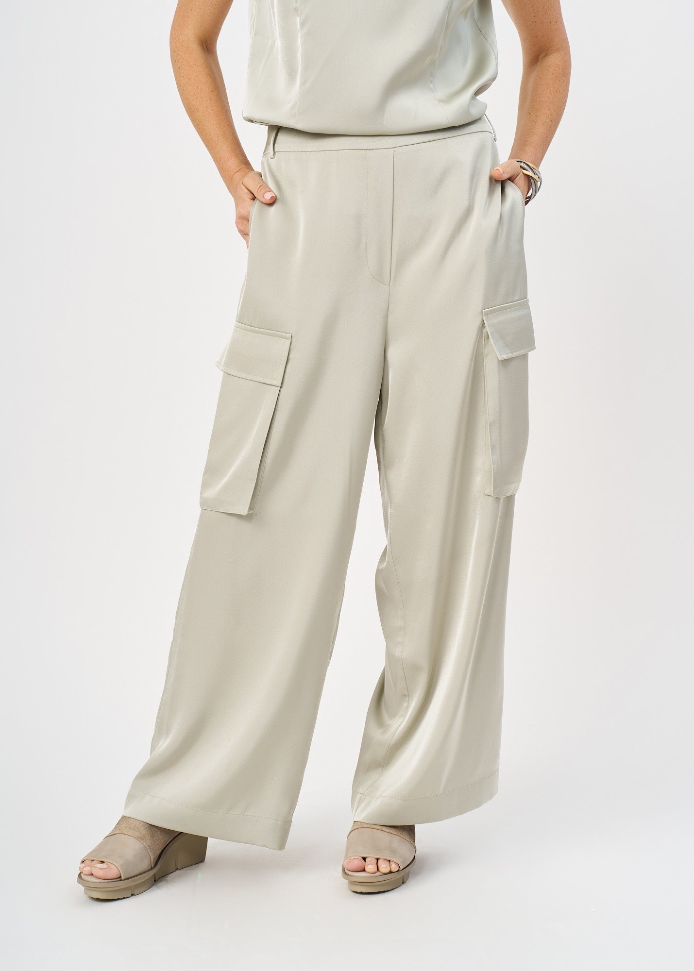Green satin pants with pockets