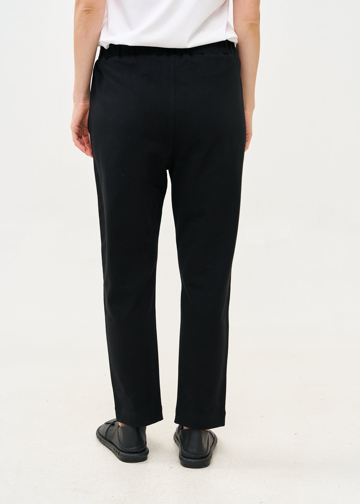 Pants seam in the middle and a black patch