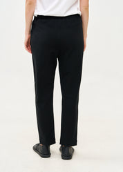 Pants seam in the middle and a black patch