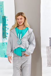 Handmade necklace straw rows and resin circle with turquoise squares