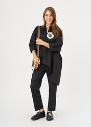 Black button-down shirt with rounded hem