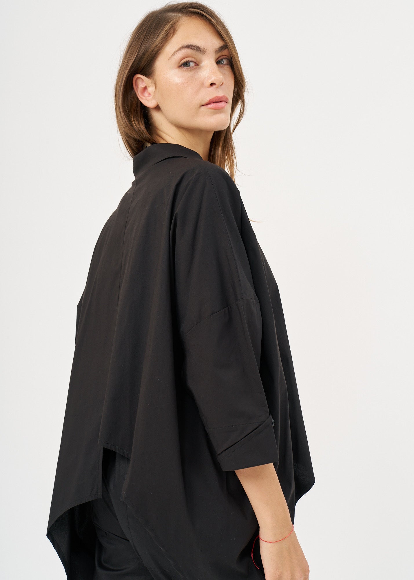 Black button-down shirt with rounded hem