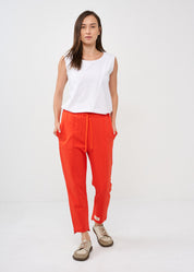 Pants with a seam in the middle and a red patch