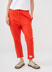 Pants with a seam in the middle and a red patch