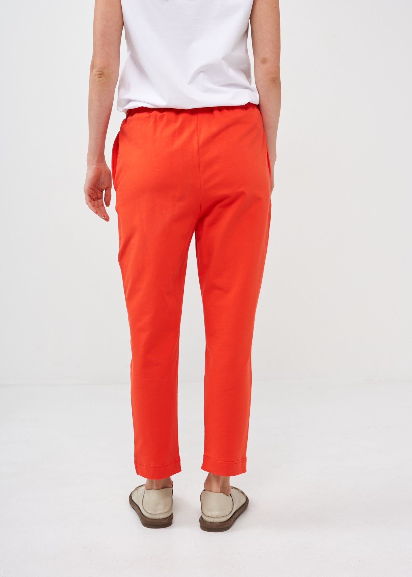 Pants with a seam in the middle and a red patch