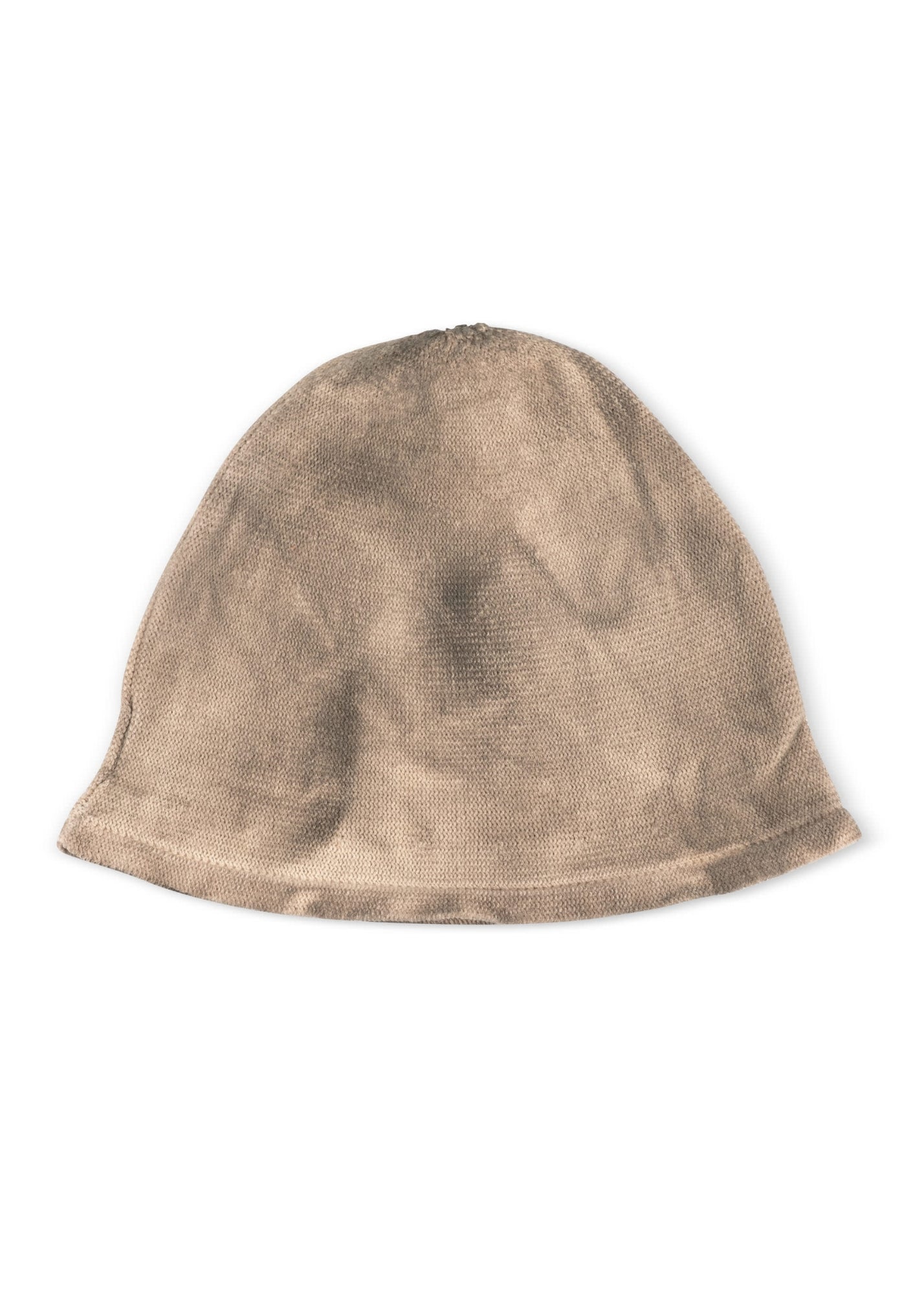 A sock hat rolls around in a beige wash