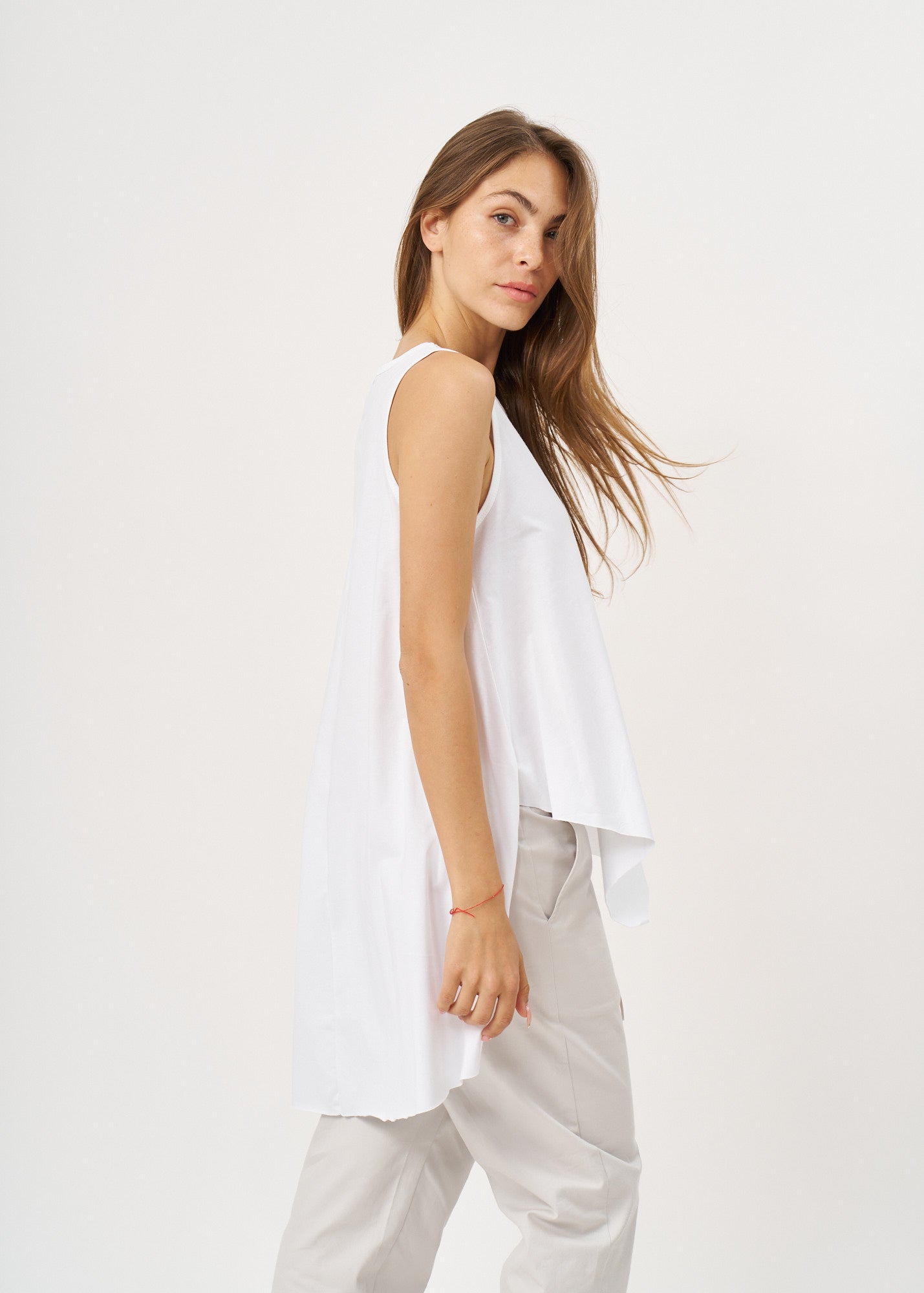 White flared tank top with a white flared hem