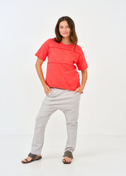 Red short sleeve shirt with prominent cuts
