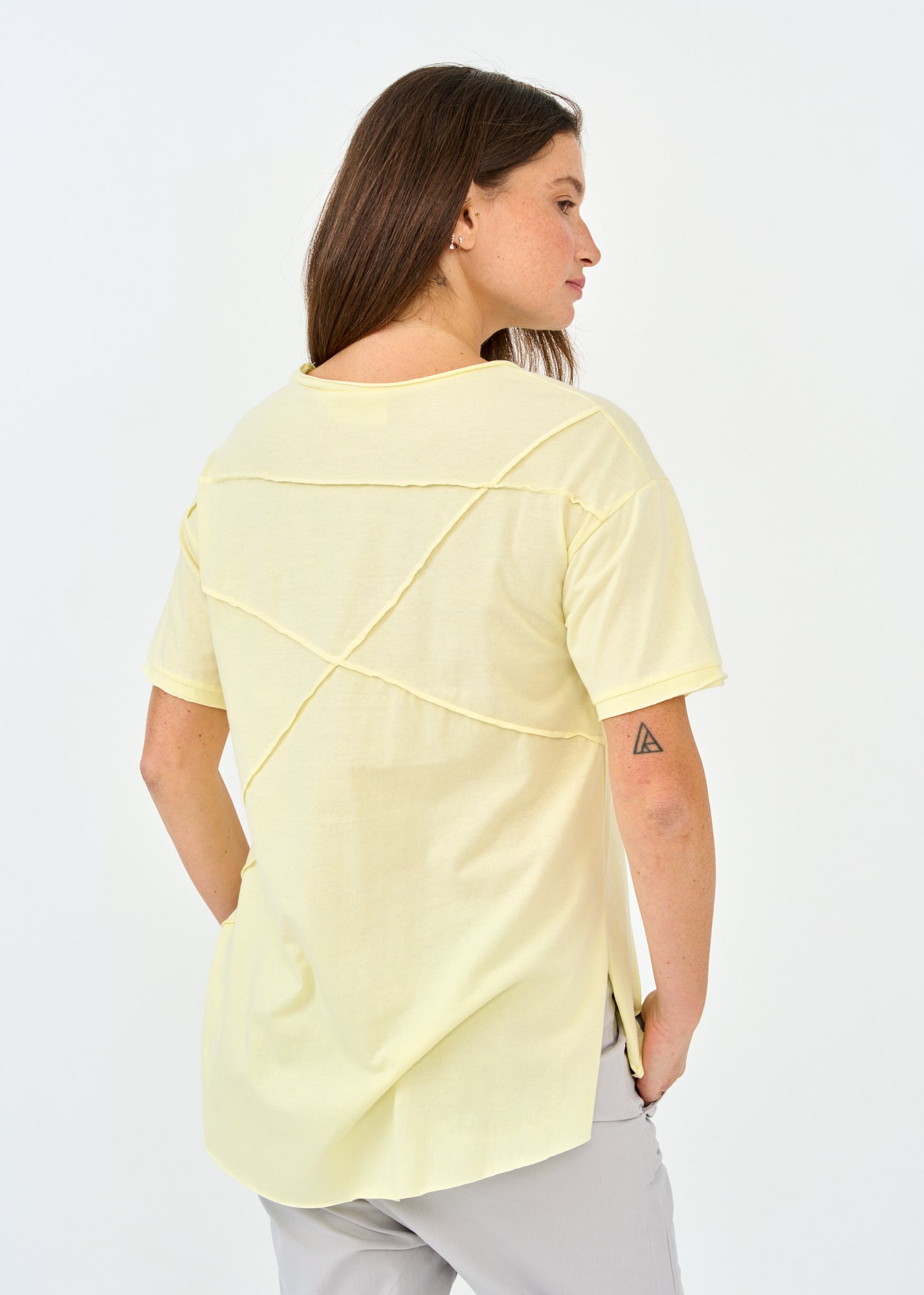 Yellow short sleeve shirt with prominent cuts