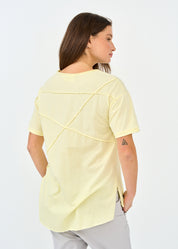 Yellow short sleeve shirt with prominent cuts
