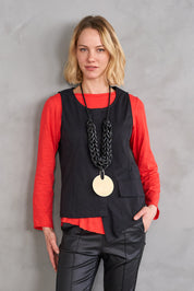 Handmade necklace with thick thread and a black round disc