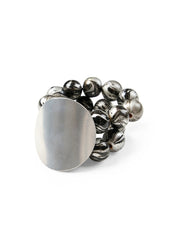 A bracelet with wooden beads and a silver disk