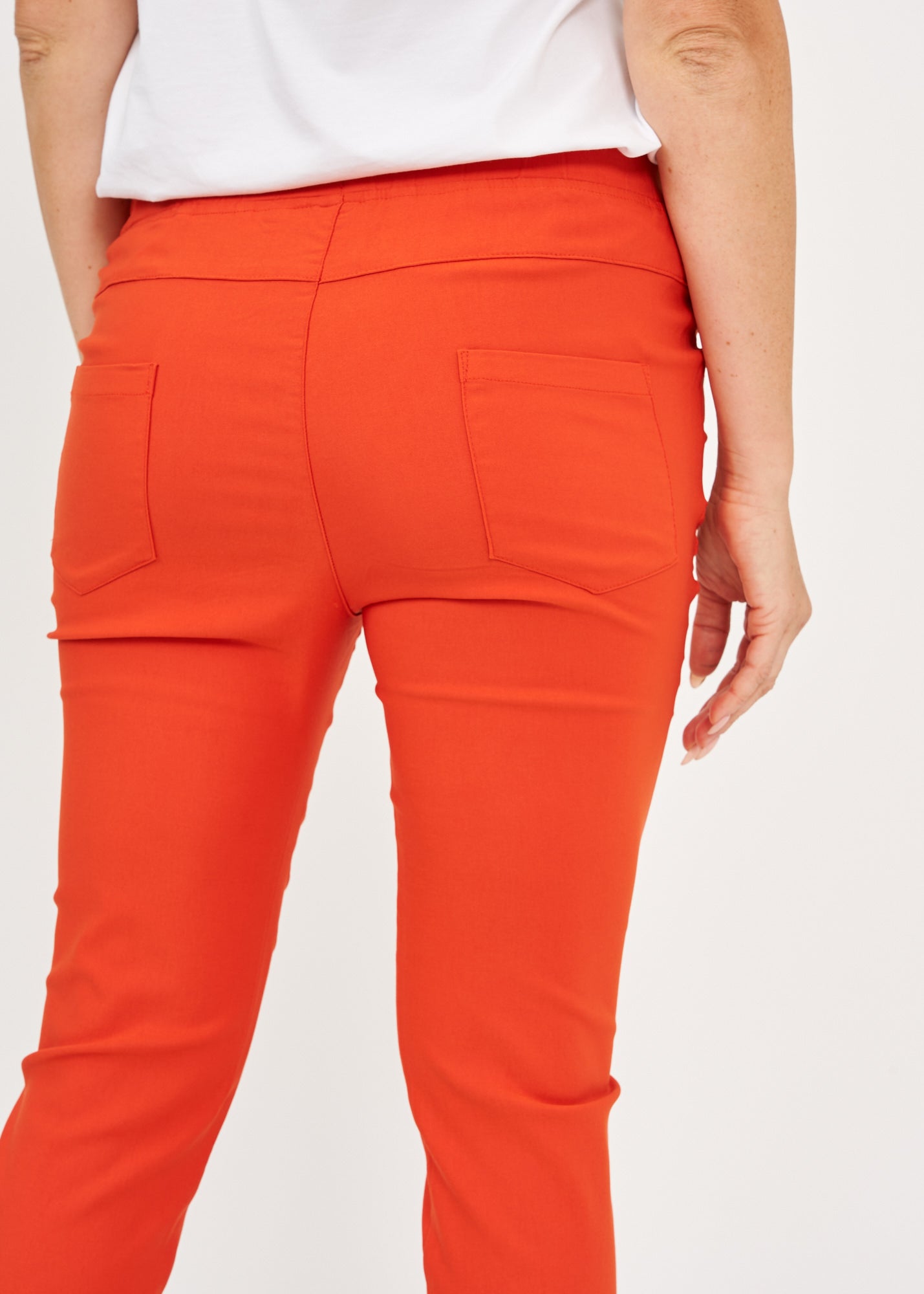 Orange rubber top tight pants