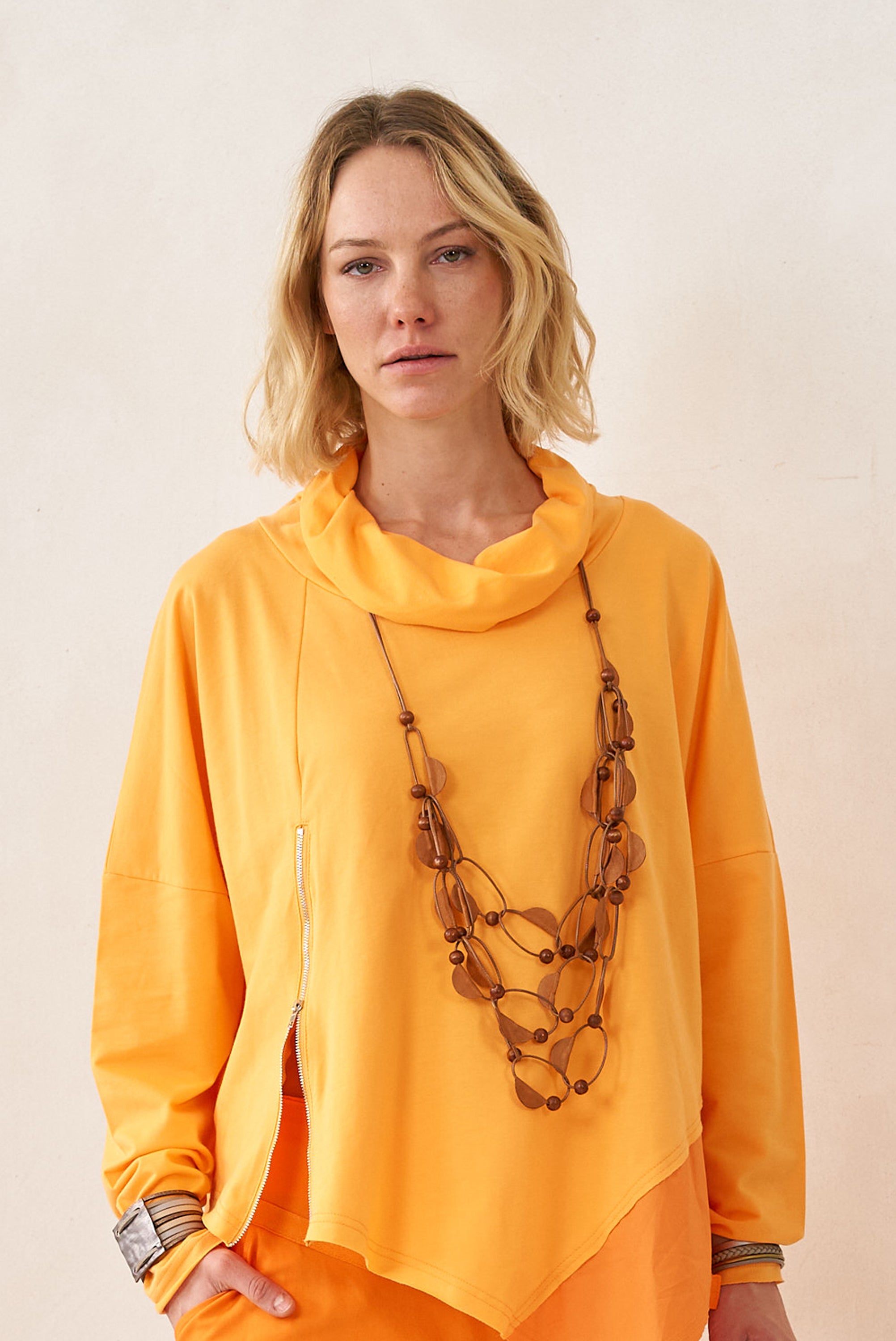 A loop chain with brown sewing leather halves on it