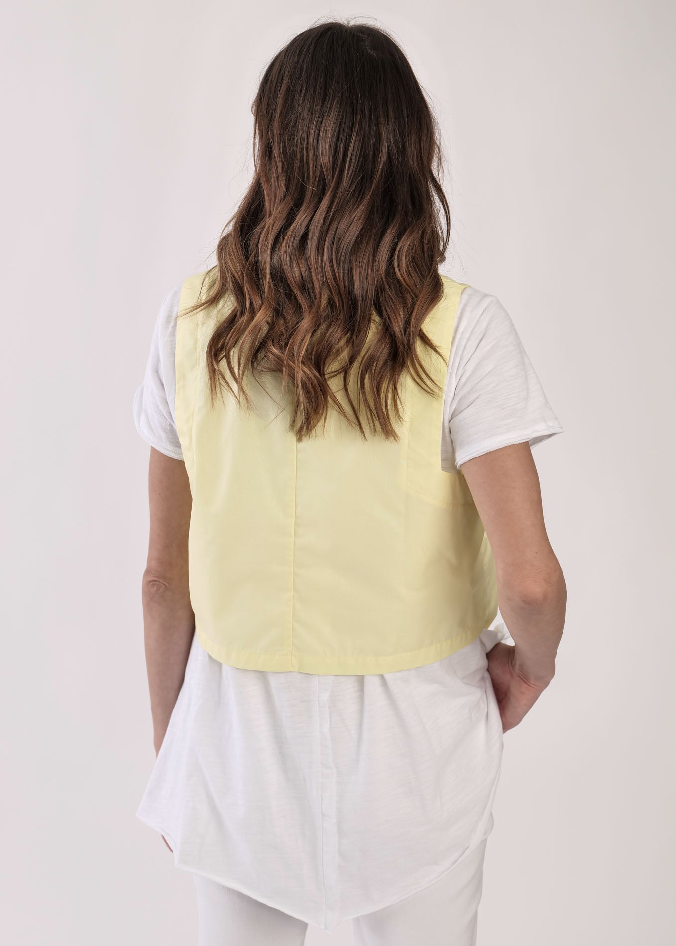 Yellow asymmetric vest with pockets