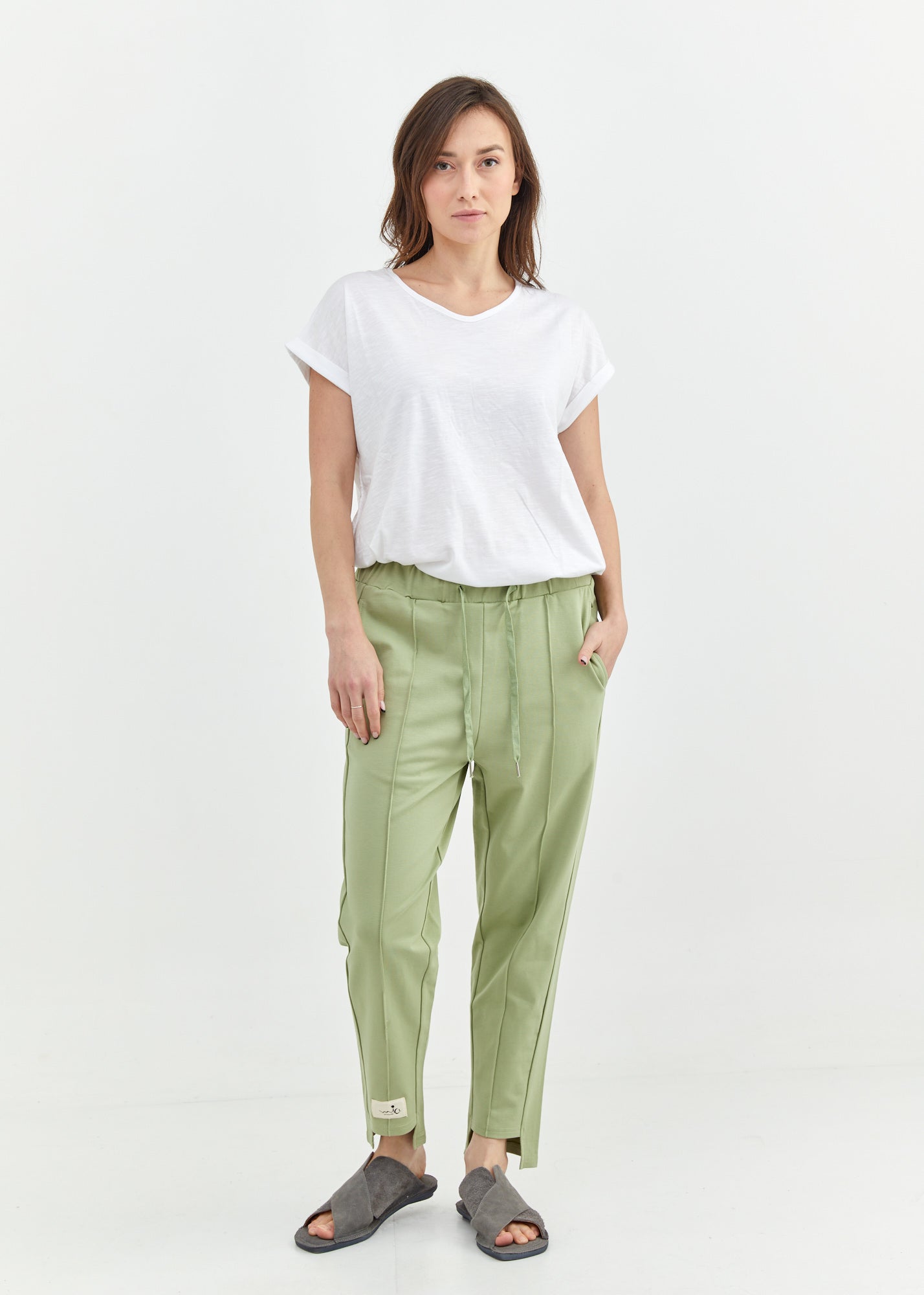 Pants with a seam in the middle and a smoky light green patch
