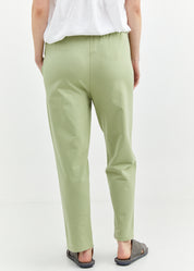 Pants with a seam in the middle and a smoky light green patch