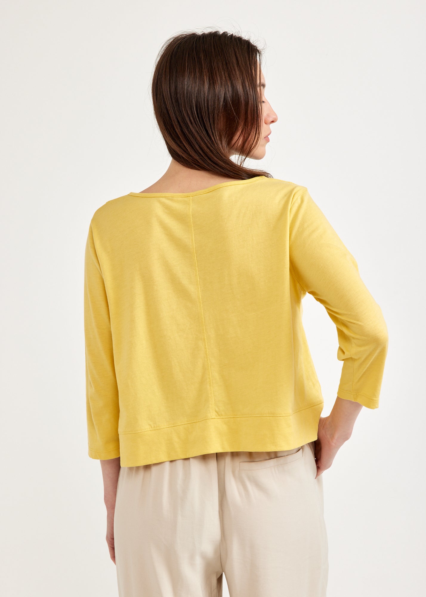 Yellow 3/4 sleeve shirt with rounded ending