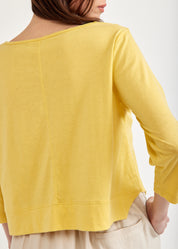 Yellow 3/4 sleeve shirt with rounded ending