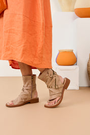 High sandals with straps and brown buckle