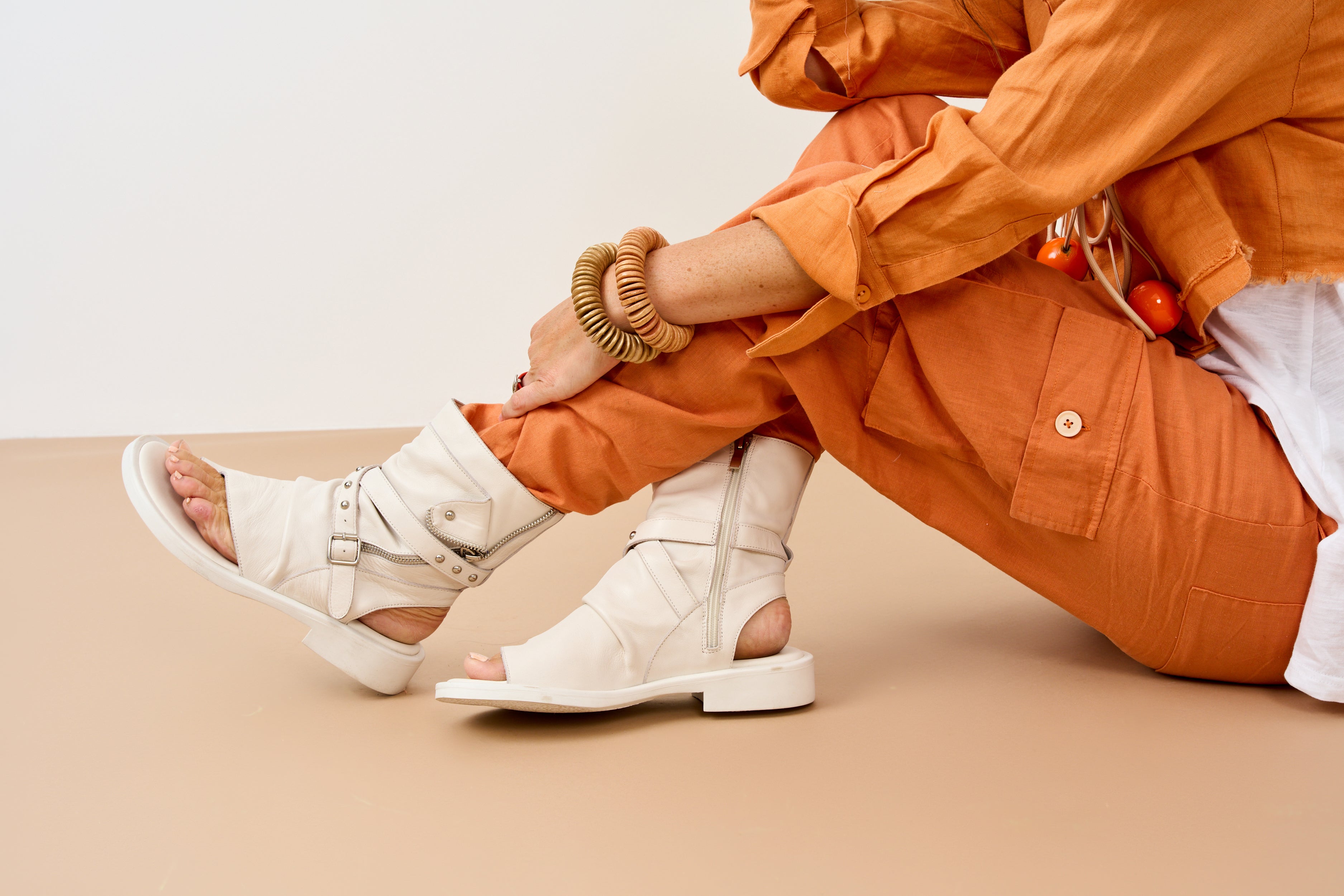 High sandals with straps and white buckle