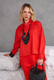 Handmade necklace with coconut circles painted black