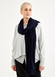 A scarf with a seam in the middle and a blue fringe