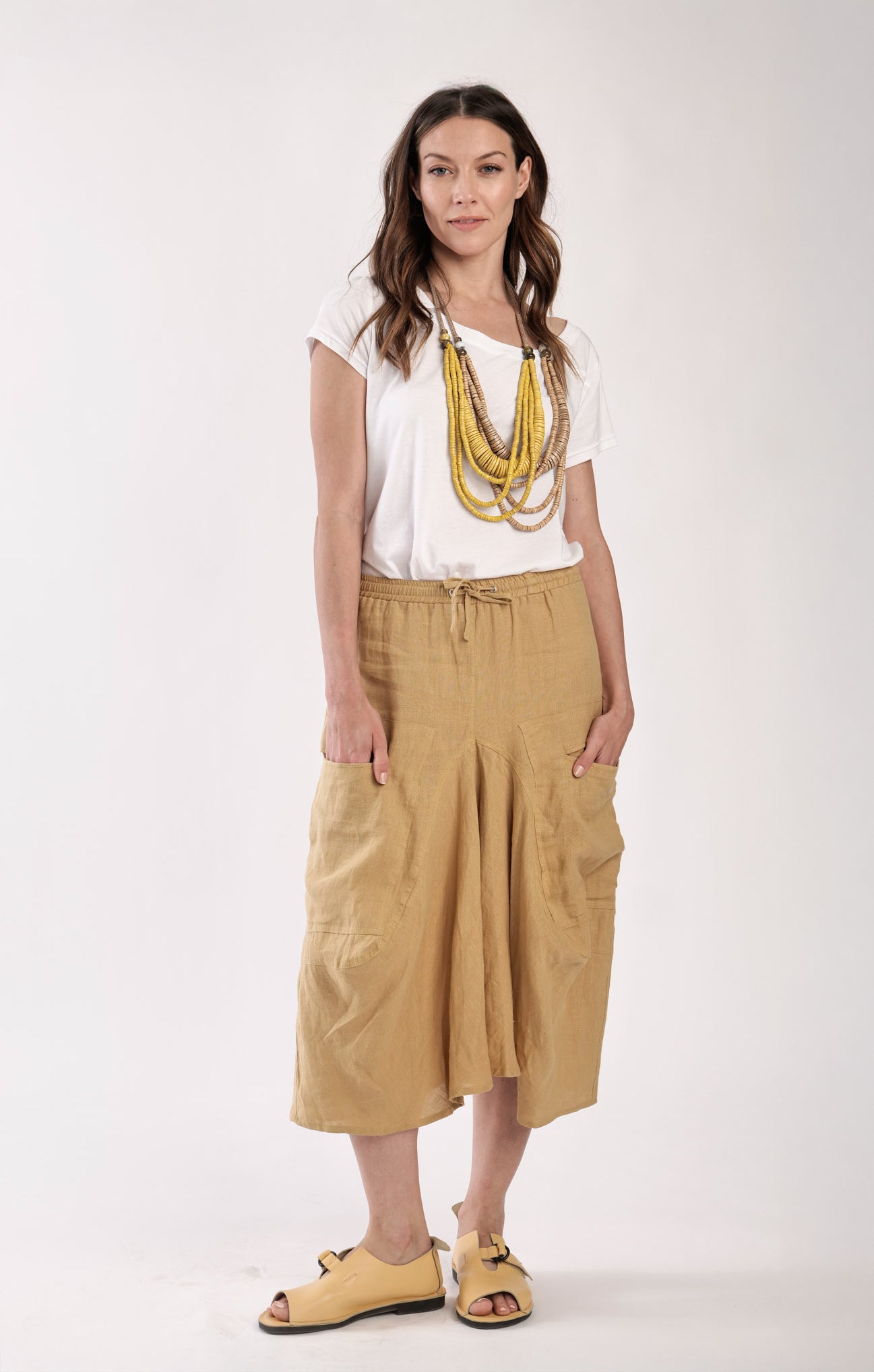 Mustard skirt pants with pockets on the sides