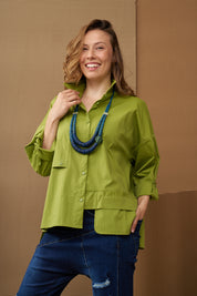 A necklace of coconut discs and a blue coiled bead