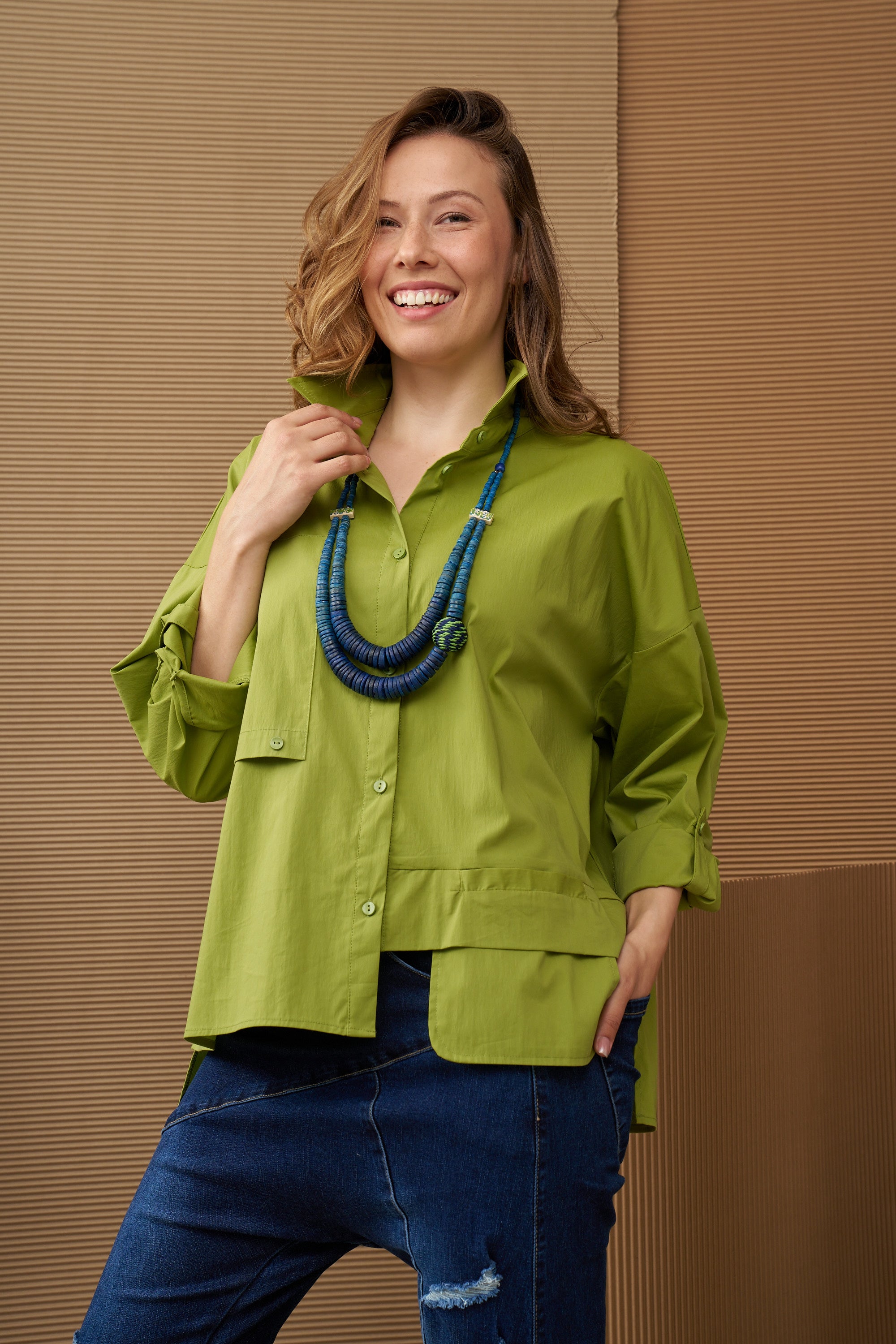 A necklace of coconut discs and a blue coiled bead