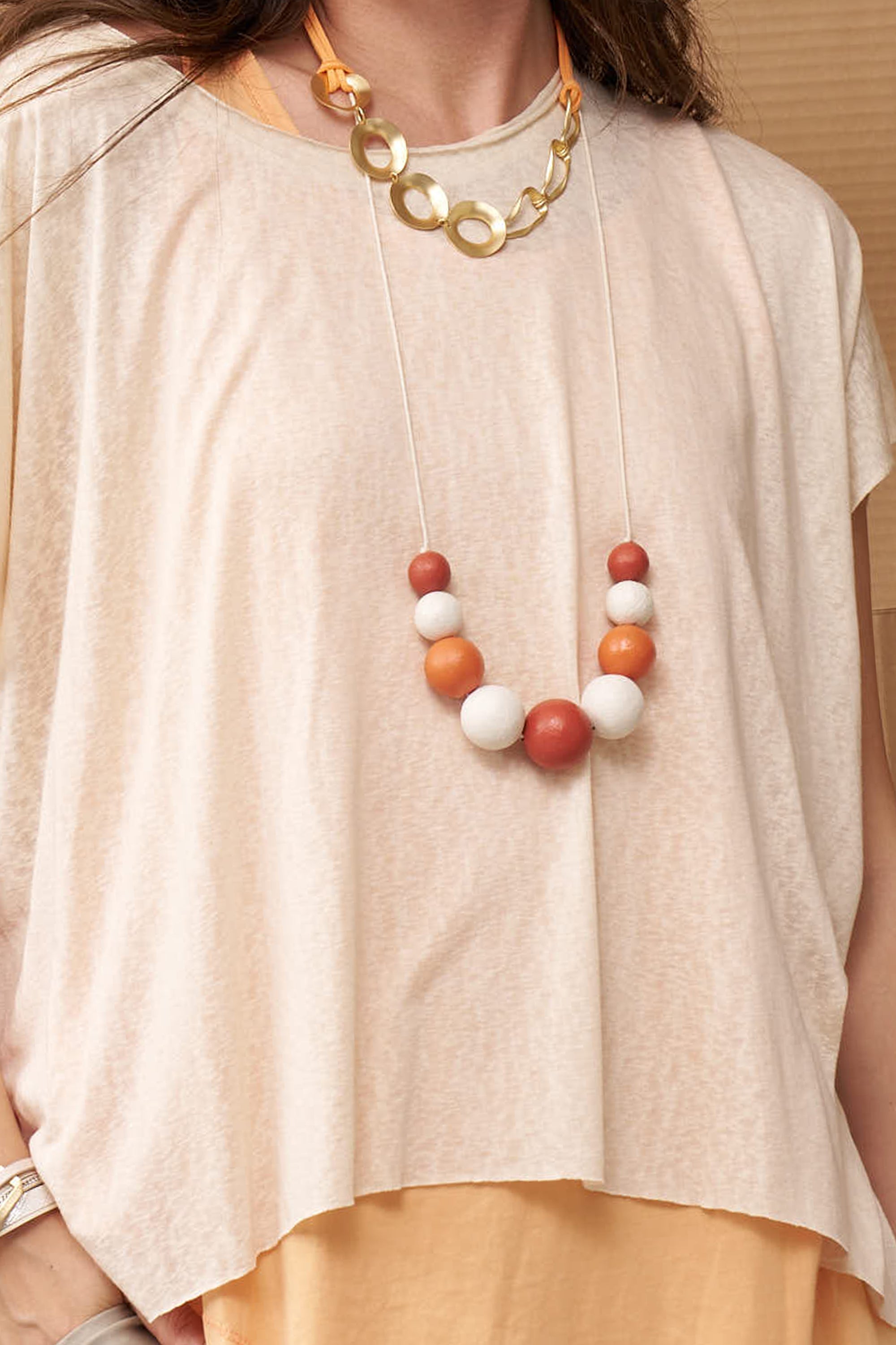 Handmade necklace made of orange wood chip beads