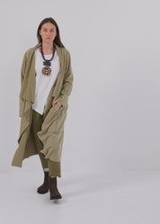 Belted top tied with a green waist