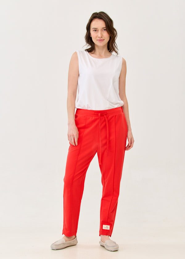 Pants with a seam in the middle and a red patch
