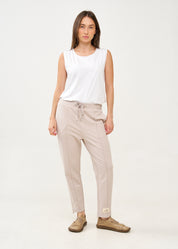 Pants with a seam in the middle and a stone patch