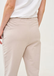 Pants with a seam in the middle and a stone patch