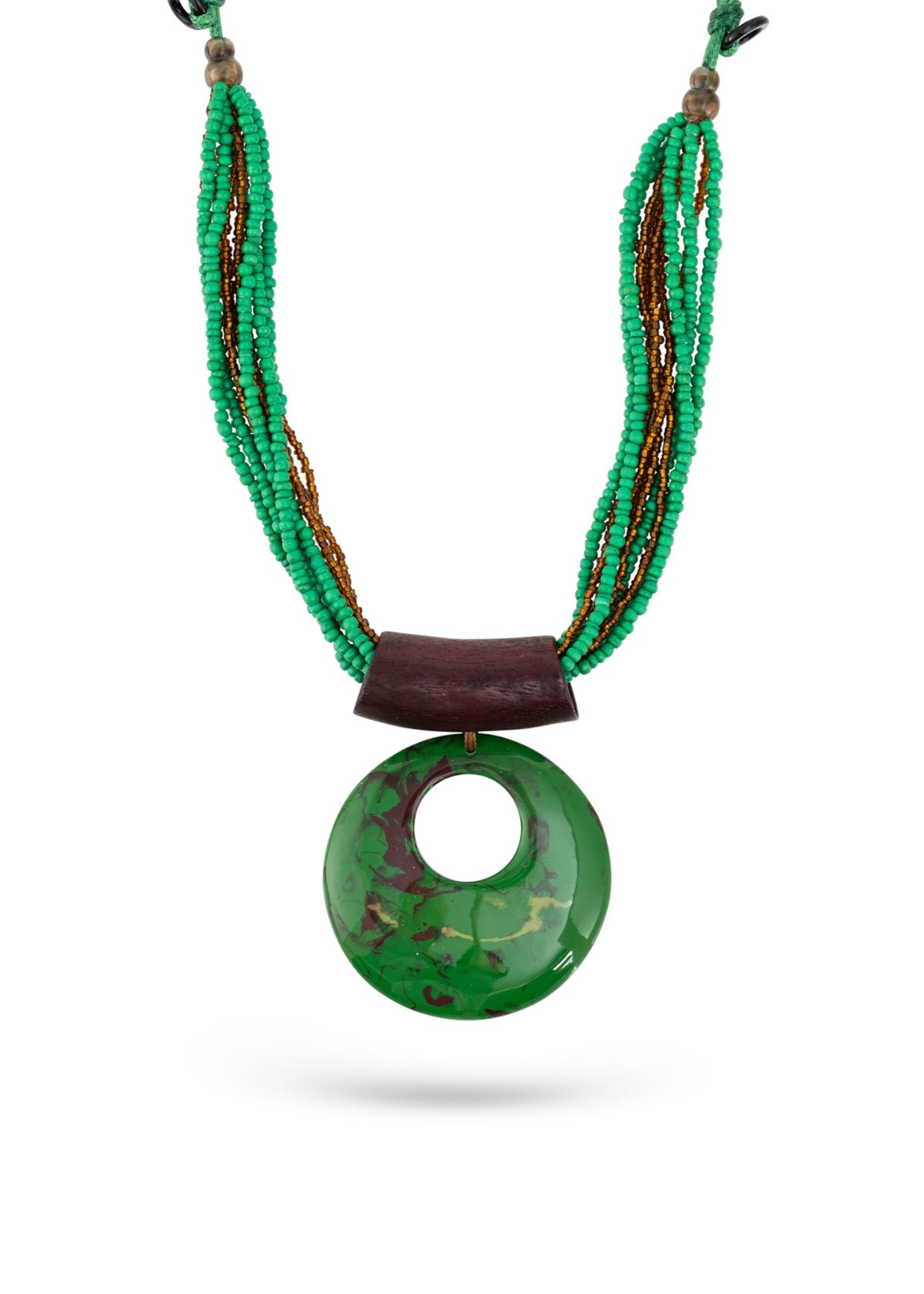 Handmade necklace with rows of beads and a green round pendant