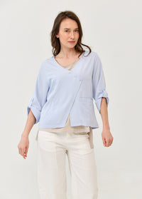 Light blue 3/4 sleeve jacket with diagonal closure and pockets - 00