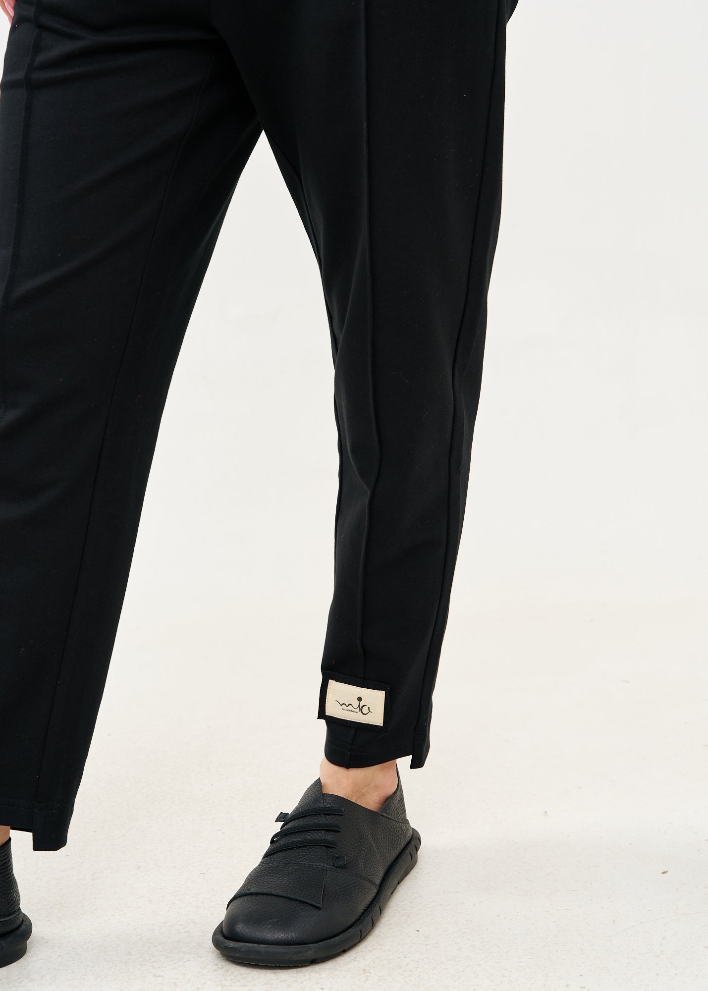 Pants seam in the middle and a black patch