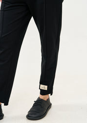 Pants seam in the middle and a black patch