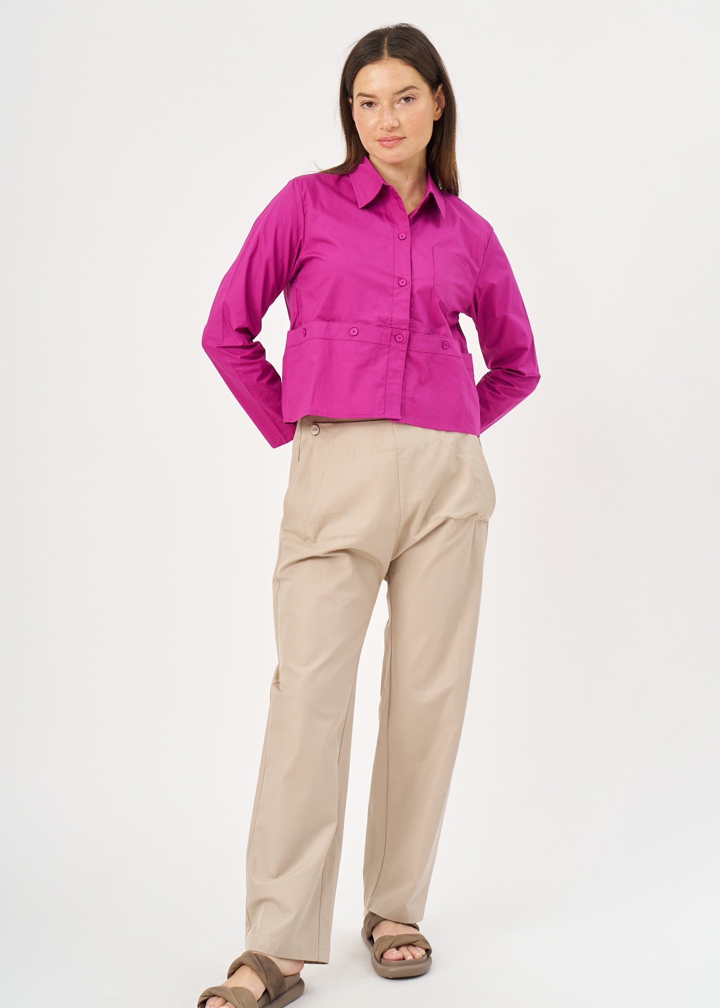 A button-up shirt is getting ready for a purple short